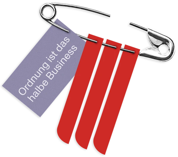 Sicherheitsnadel mit Zettel: Ordnung ist das halbe Business